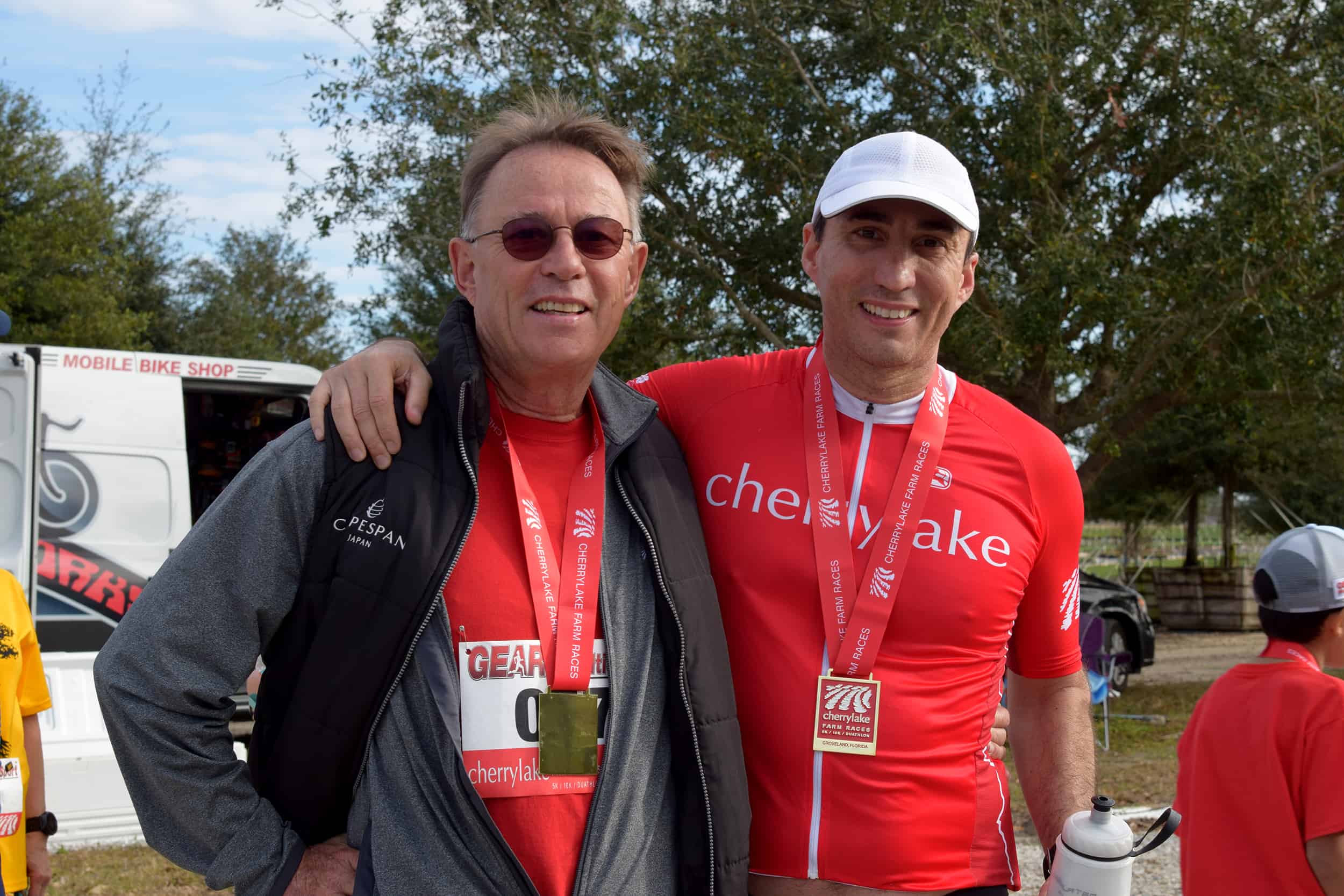 Cherrylake Founder, Michel Sallin, and Son, Timothee Sallin, smile after a race.
