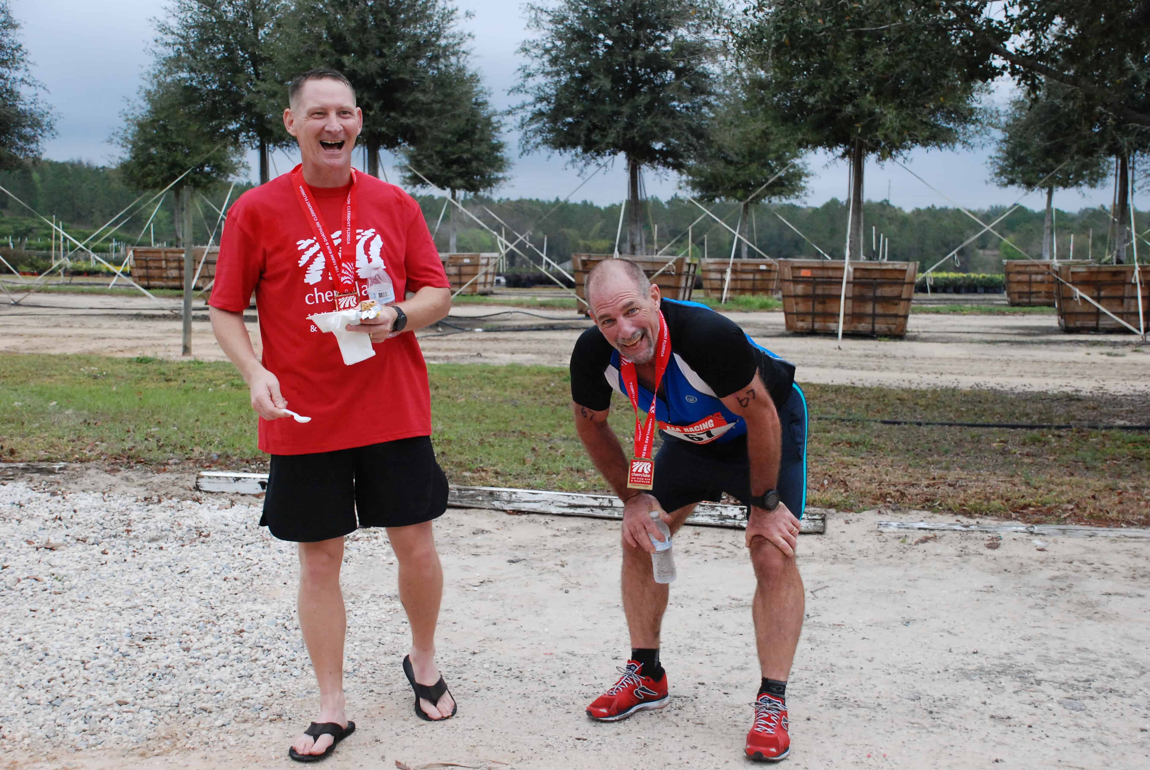 Two men laughing after completing the race.