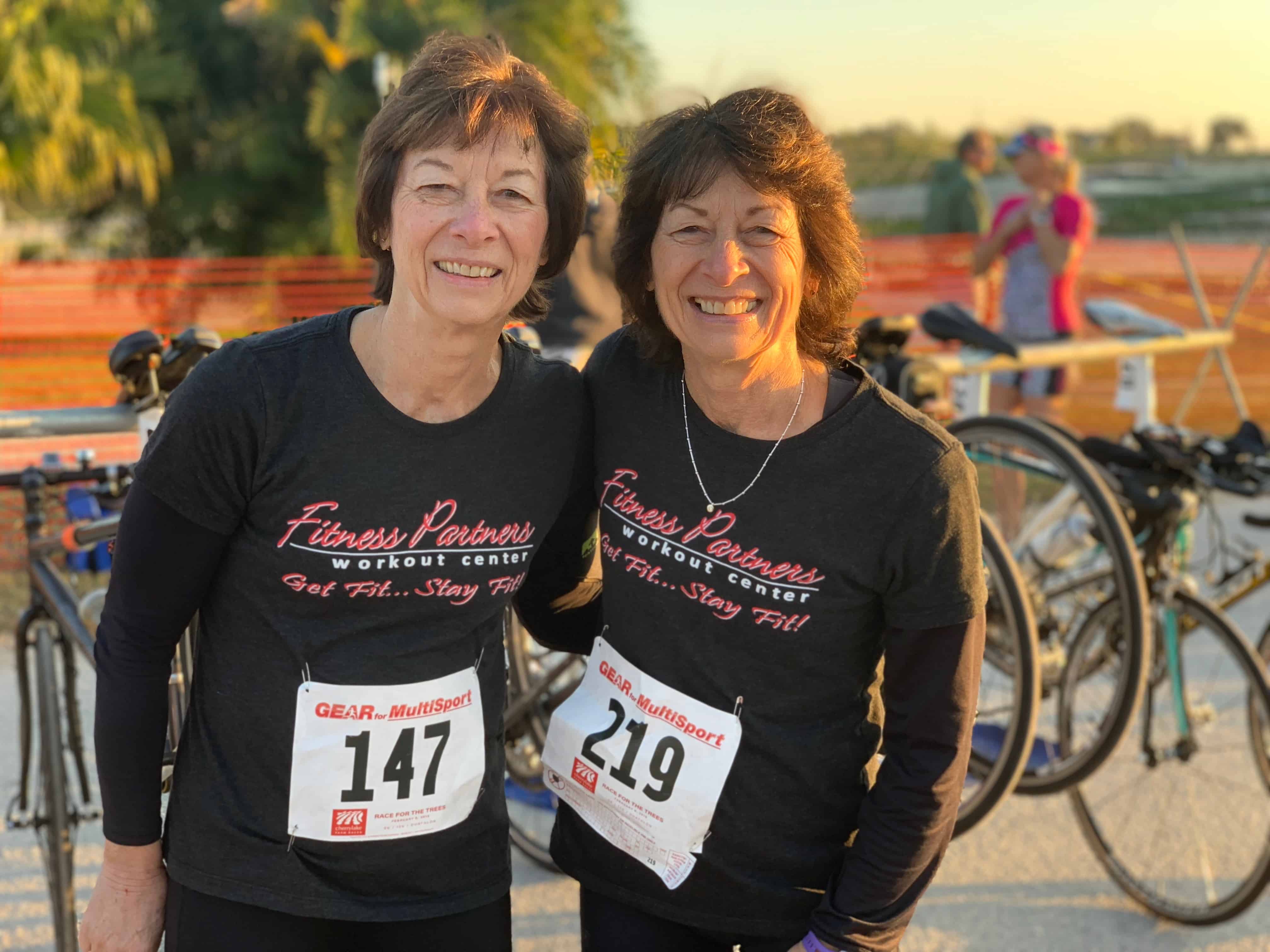 Two women smile after a completed race.